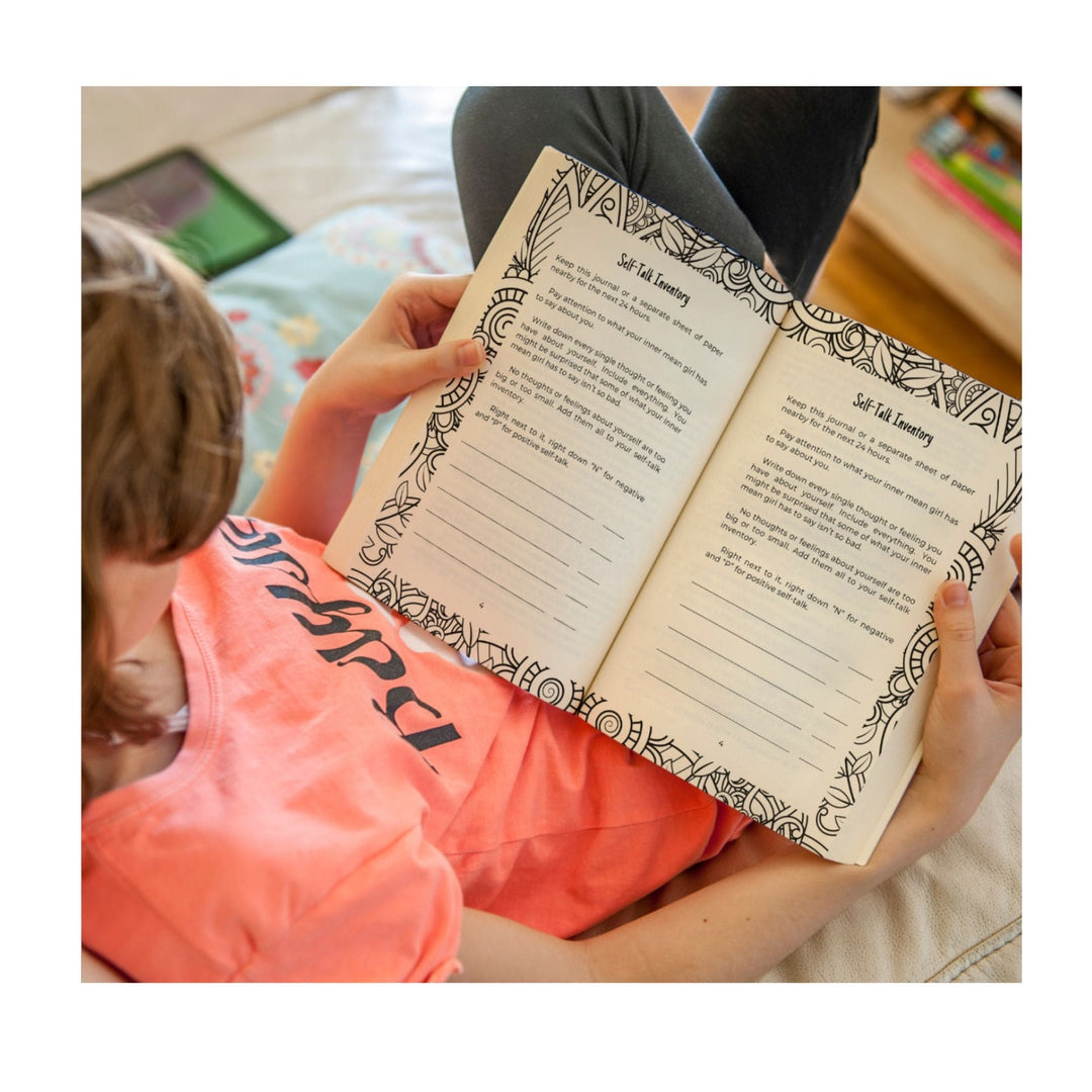 Close-up of the spiral binding and textured cover of the Damn Mind journal, highlighting the black and white patterned