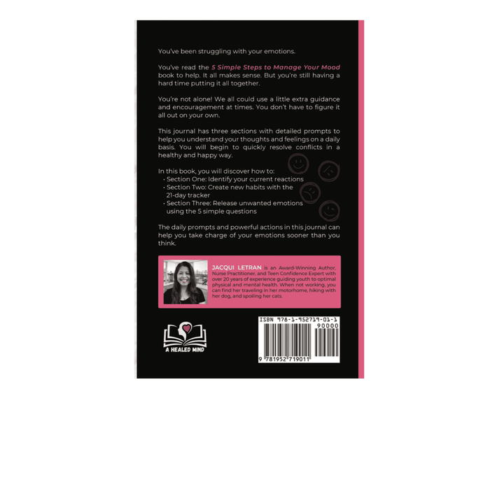 Close-up of the journal's textured pastel pink cover with embossed title and silver foil accents reflecting light from a