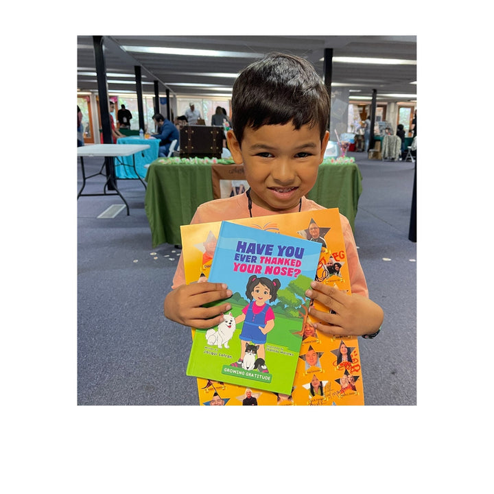 Close-up of the paperback’s textured cover featuring vibrant yellow and orange hues with a playful font detail from this