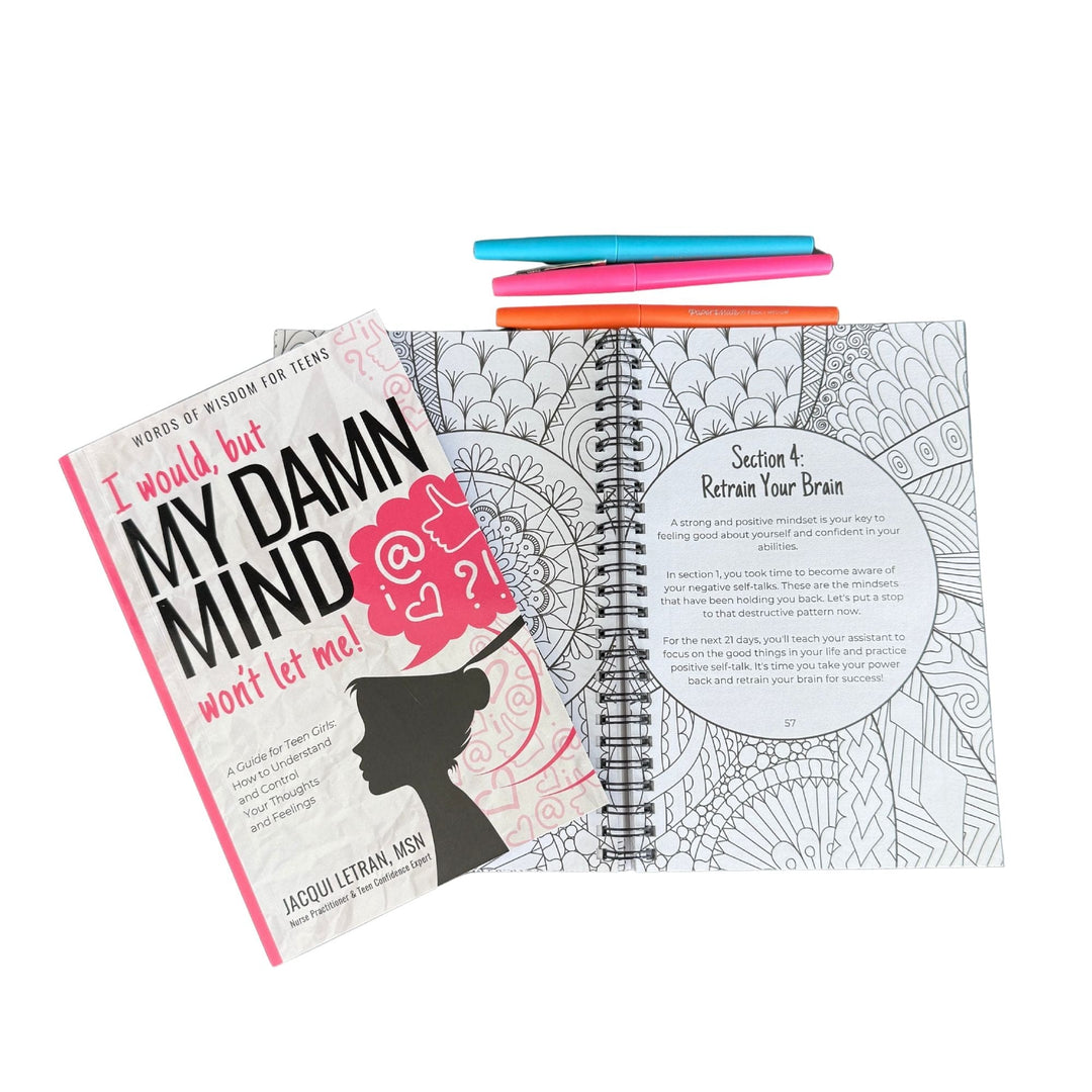 Close-up of the spiral journal’s textured black cover with "Damn Mind" embossed in bold white letters and visible spiral