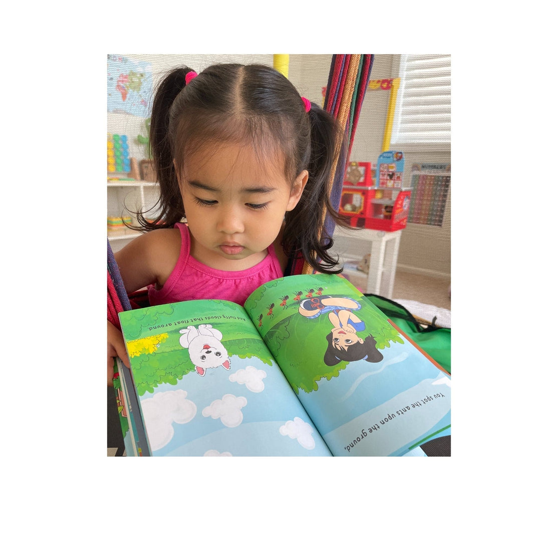 Close-up of textured hardcover book spine showing embossed title and colorful imagery on the front cover