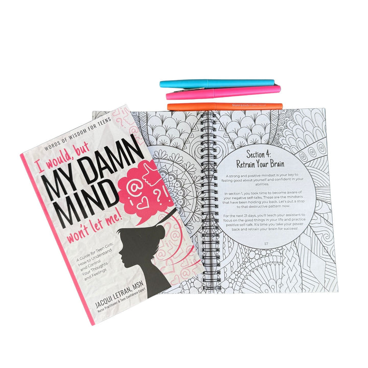 Close-up of colorful paperback cover edge showing textured matte finish and vibrant pink, purple, and teal hues on teen girl