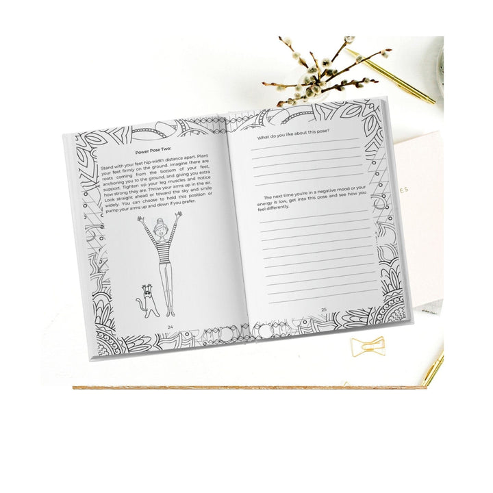 Close-up of the journal’s textured cover featuring vibrant pink and purple floral illustrations, highlighting the inspiring