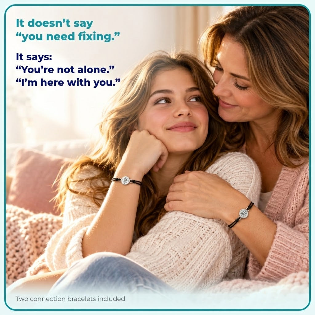 mother and daughter, cuddling, showing off connection bracelets.