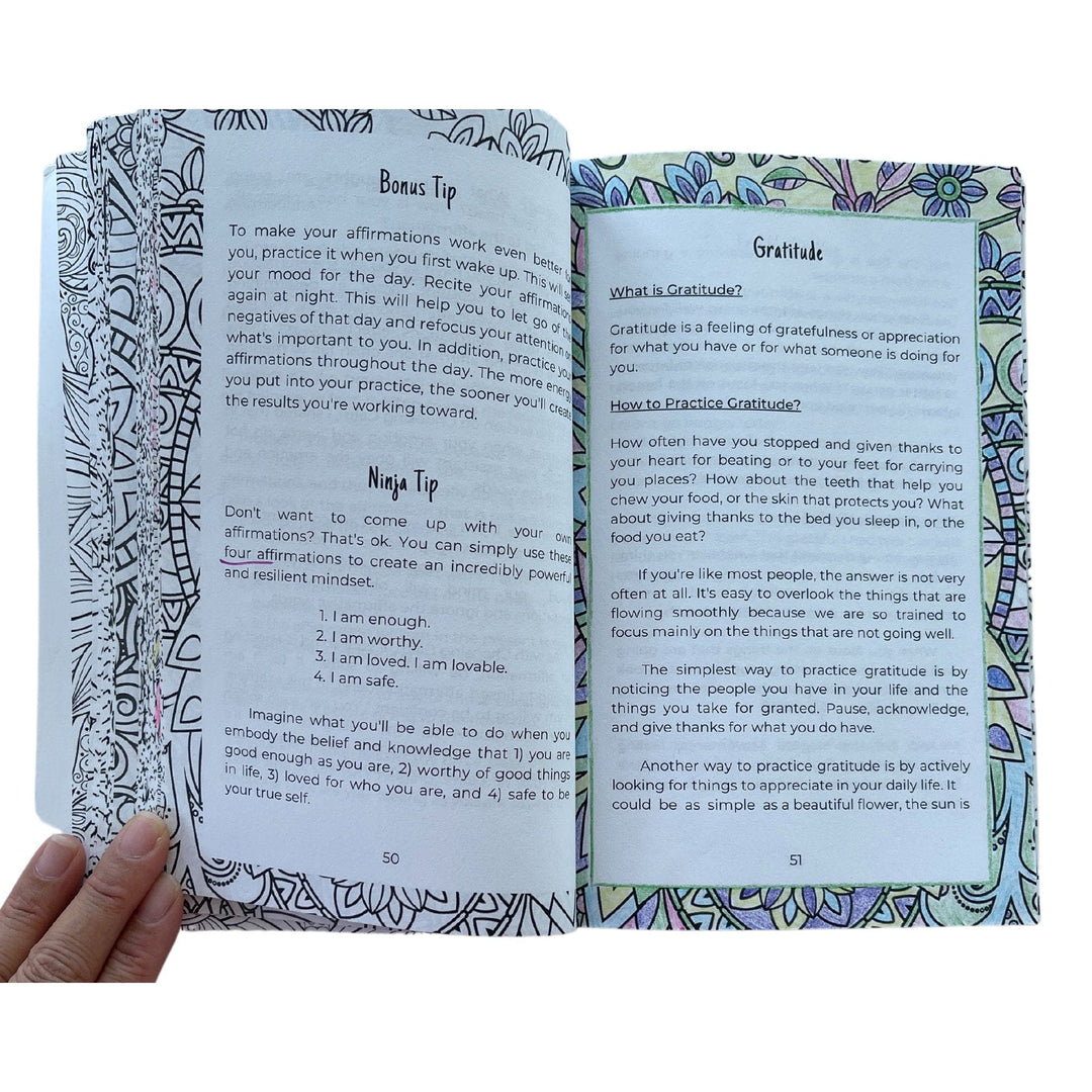 Close-up of the spiral binding and textured cover, showcasing the durable silver coil and vibrant teal background of the