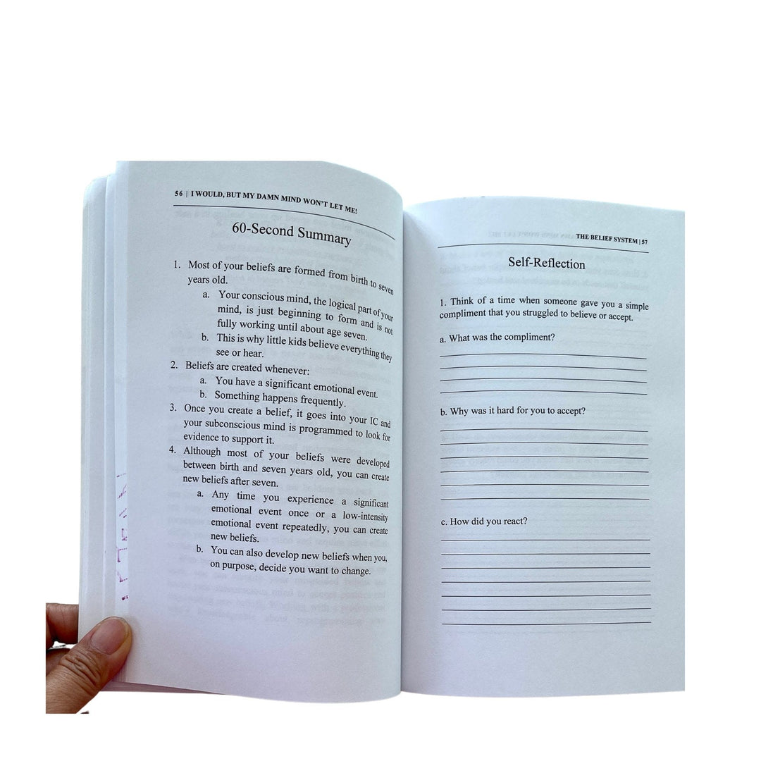 Close-up of the paperback cover displaying vibrant typography and textured surface at an overhead angle.