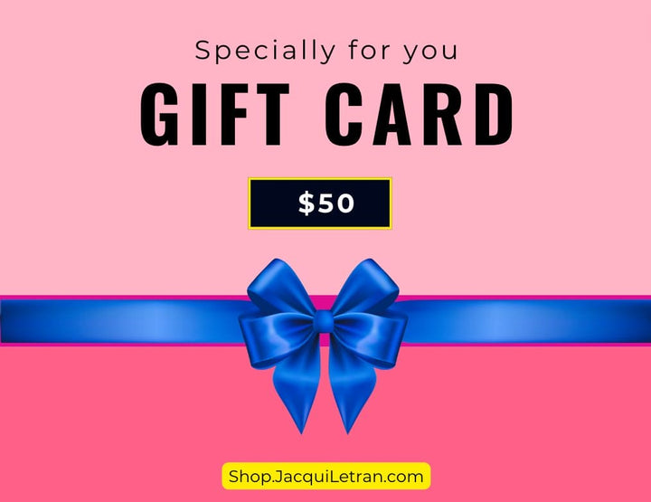 Close-up of the gift card's textured surface with embossed lettering and vibrant red and gold foil accents.