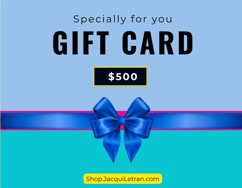 Close-up of the gift card’s textured paper surface with embossed gold lettering and a colorful ribbon border.