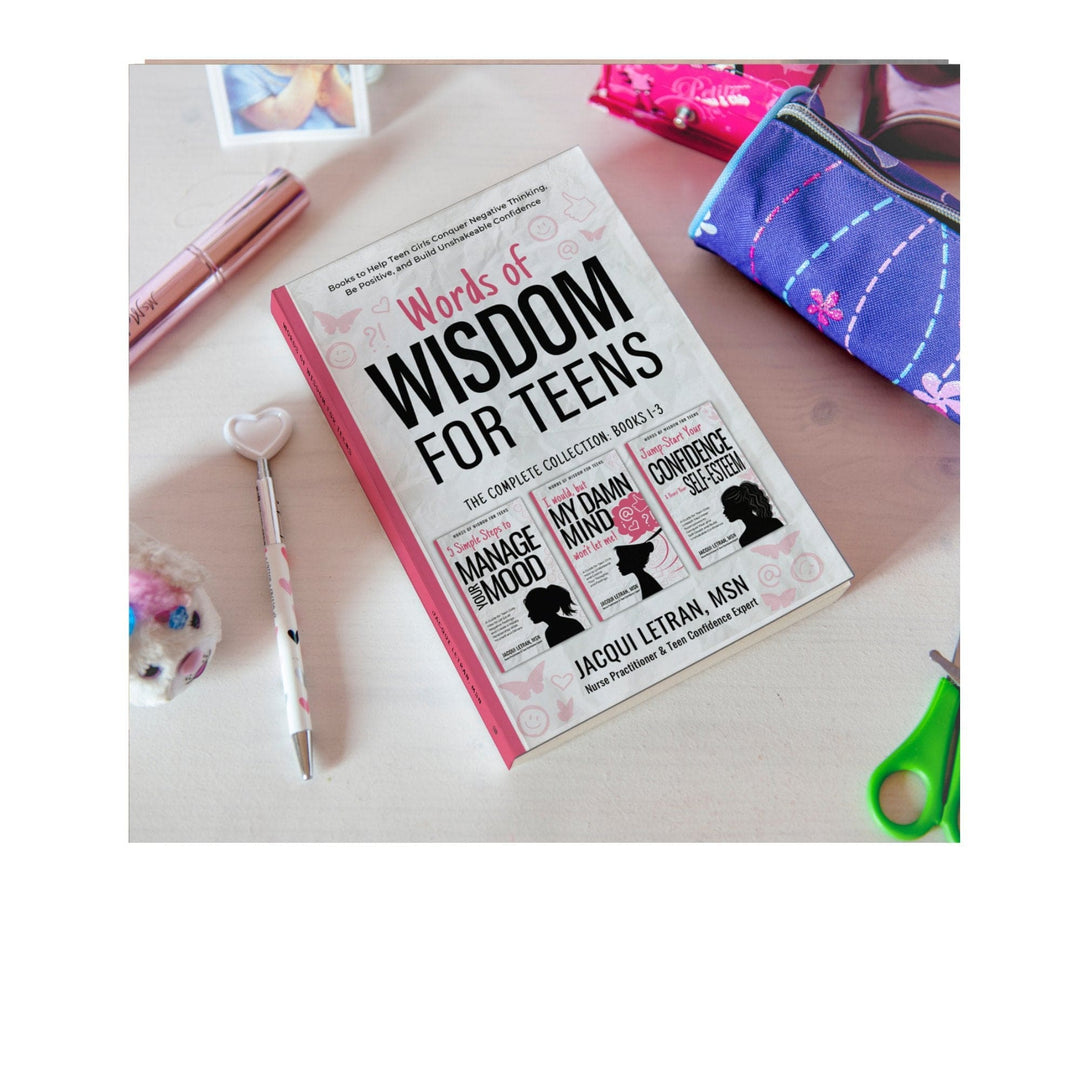 Close-up of the bundle’s spine showing colorful title design and embossed logo on the notebook cover.