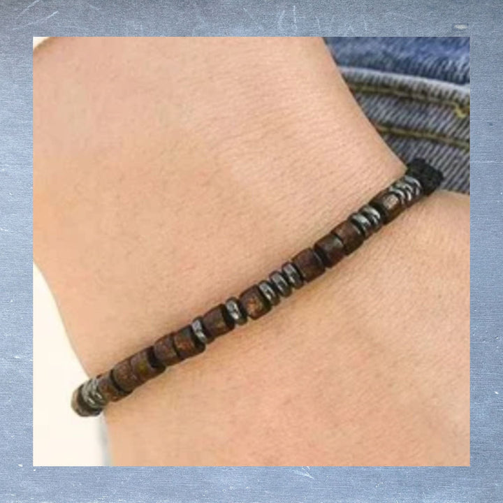 Close-up of the Morse code bracelet's silver chain highlighting the engraved "I LOVE YOU" message and textured link details