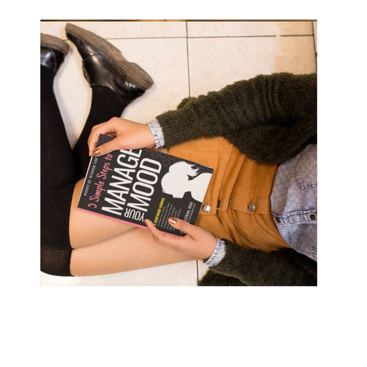 Close-up of the Teen Girls Manage Mood Journal's embossed floral cover with textured surface and gold foil detailing